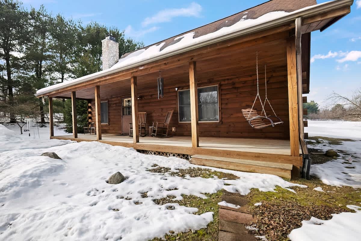 A classic covered porch with a swing = your ideal country getaway.