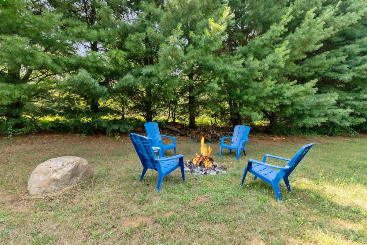 Gather around your private fire pit with comfy Adirondacks.