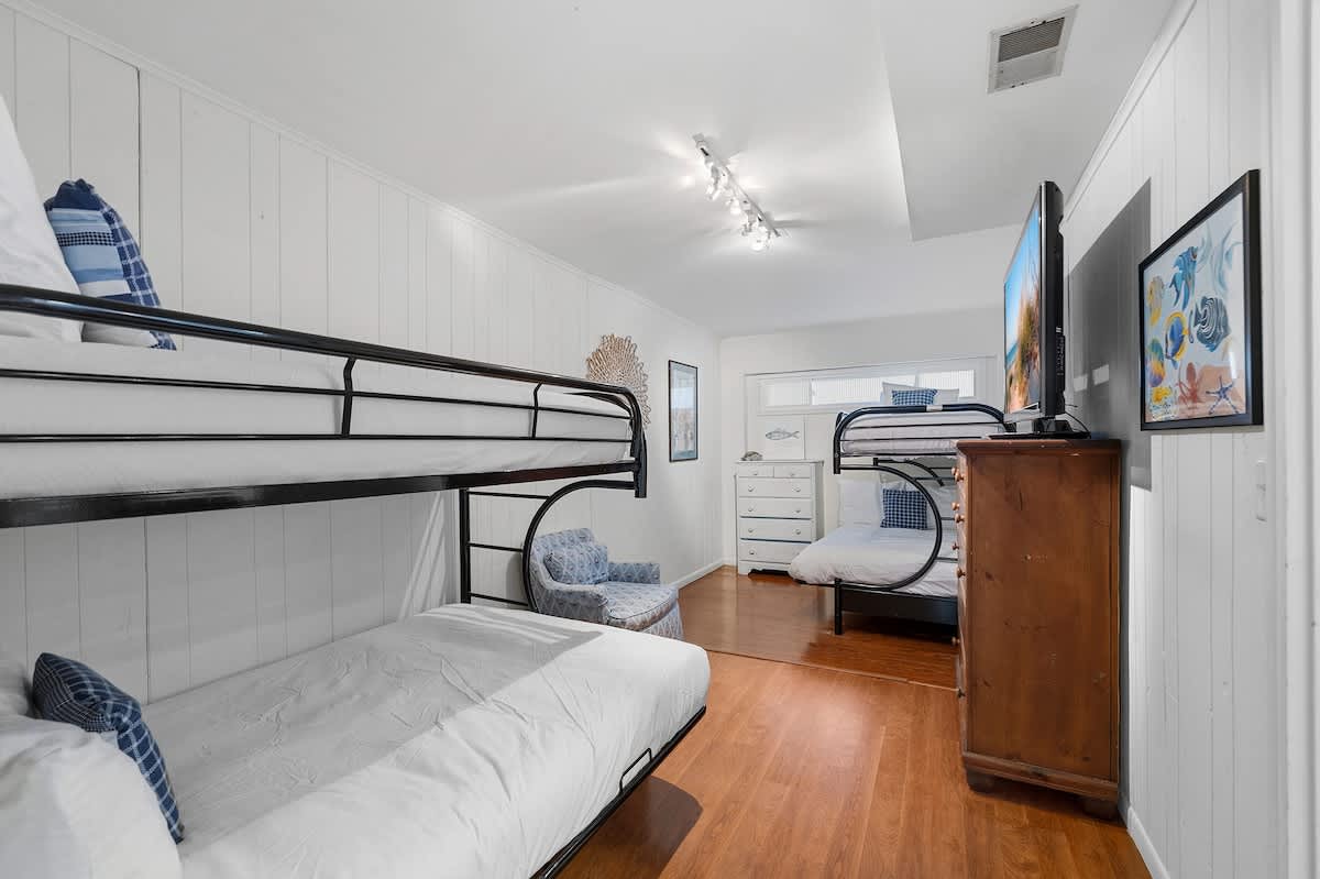 Bedroom 6 is on the lower level and has a 2 single bunk beds.