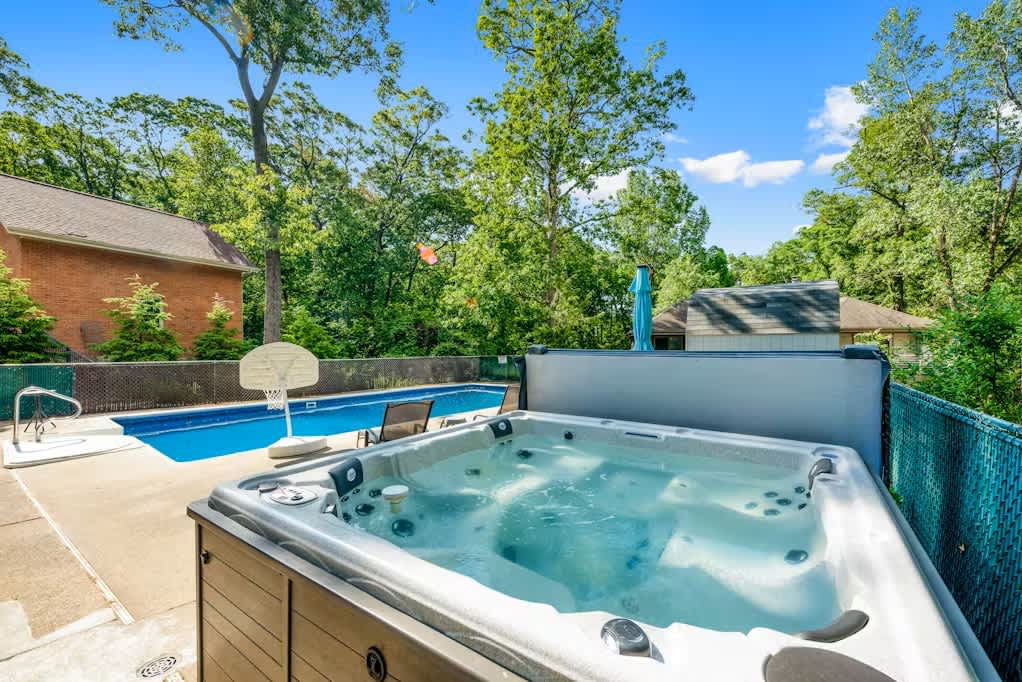 Unwind in the hot tub after a refreshing pool swim.