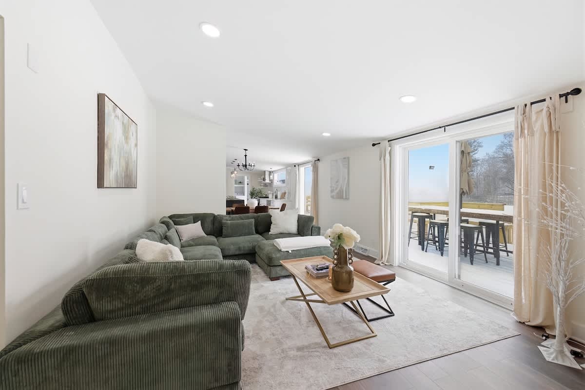 Large sliding doors blend indoor comfort with easy access to the deck.