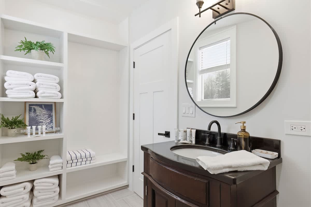Bright and organized, this guest bath offers plenty of storage for your stay.