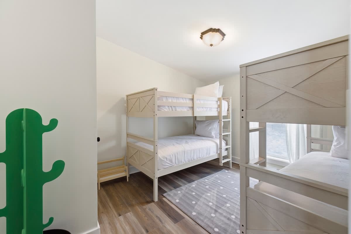 Modern bunks and a playful design make this the perfect space for kids.
