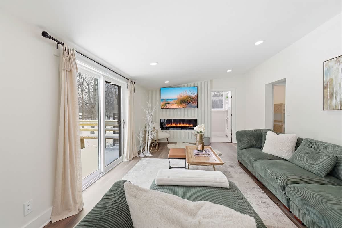 Sliding glass doors bring light and outdoor access to the living room.