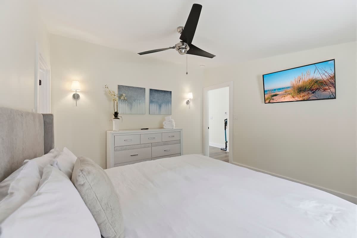 This bedroom gives guests extra space and a television of their own.