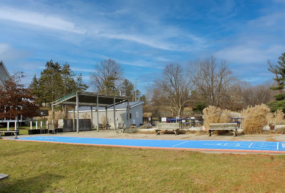 Lazy chalet days with shuffleboard, sunshine, and open-air lounging.