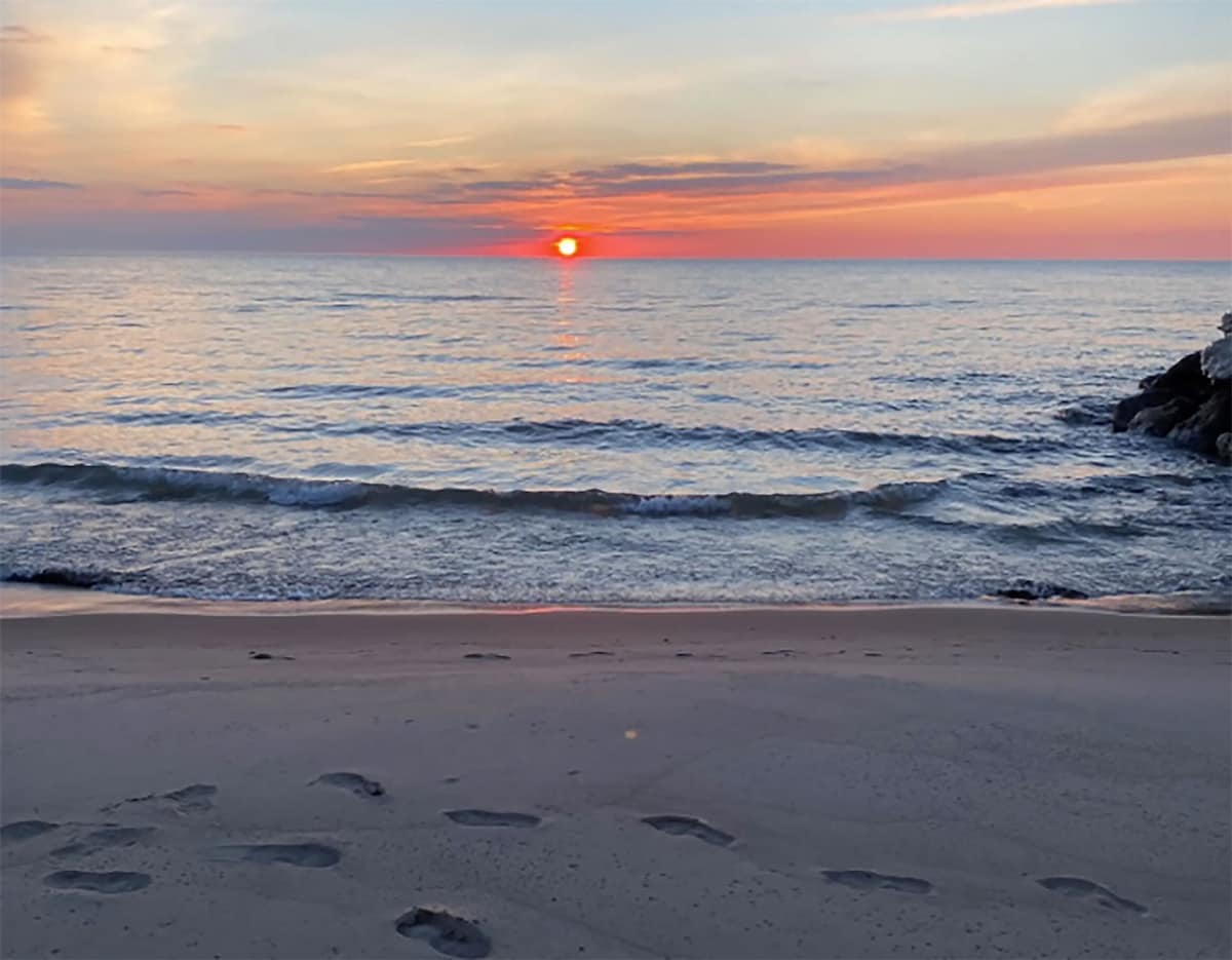 Enjoy calm evening walks along our beach as the sun sets over Lake Michigan.