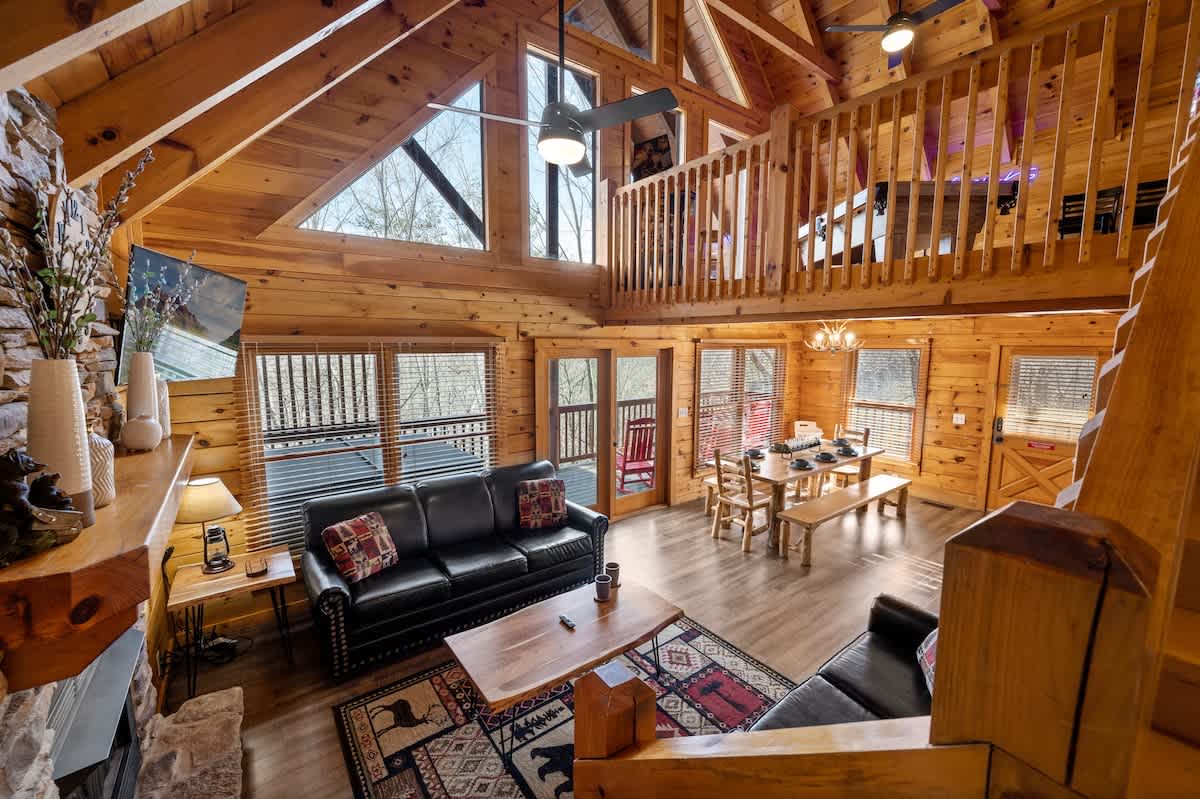 Looking down on living and dining from the stair landing heading up to the loft area!