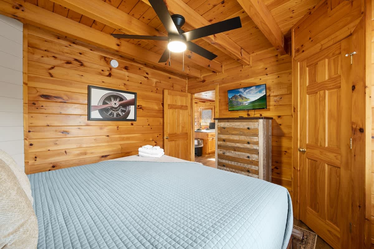 Main level bedroom (King) adjacent to kitchen area.