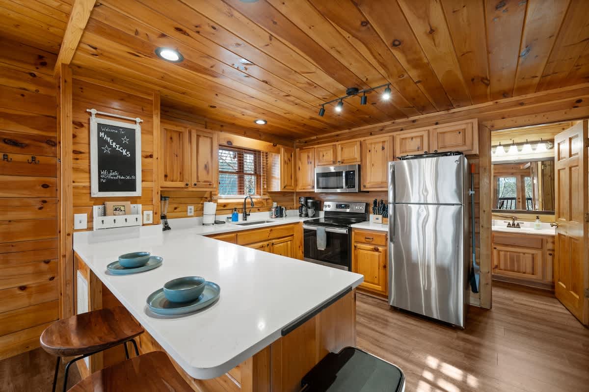 Gorgeous kitchen with quartz countertops that is well-stocked!