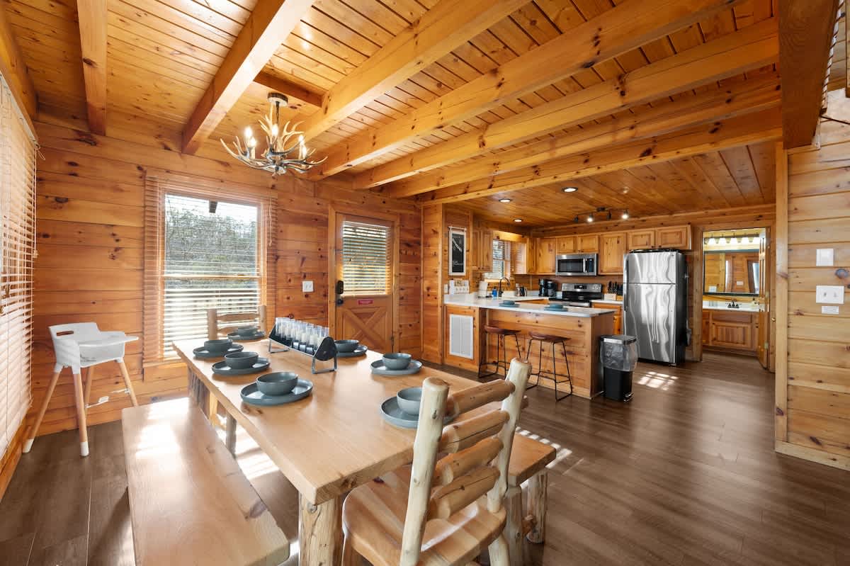 Dining room area comfortably seats eight (8), with seating for two (2) more at the bar = 10 total dining spots!   Note the children's high-chair as well!