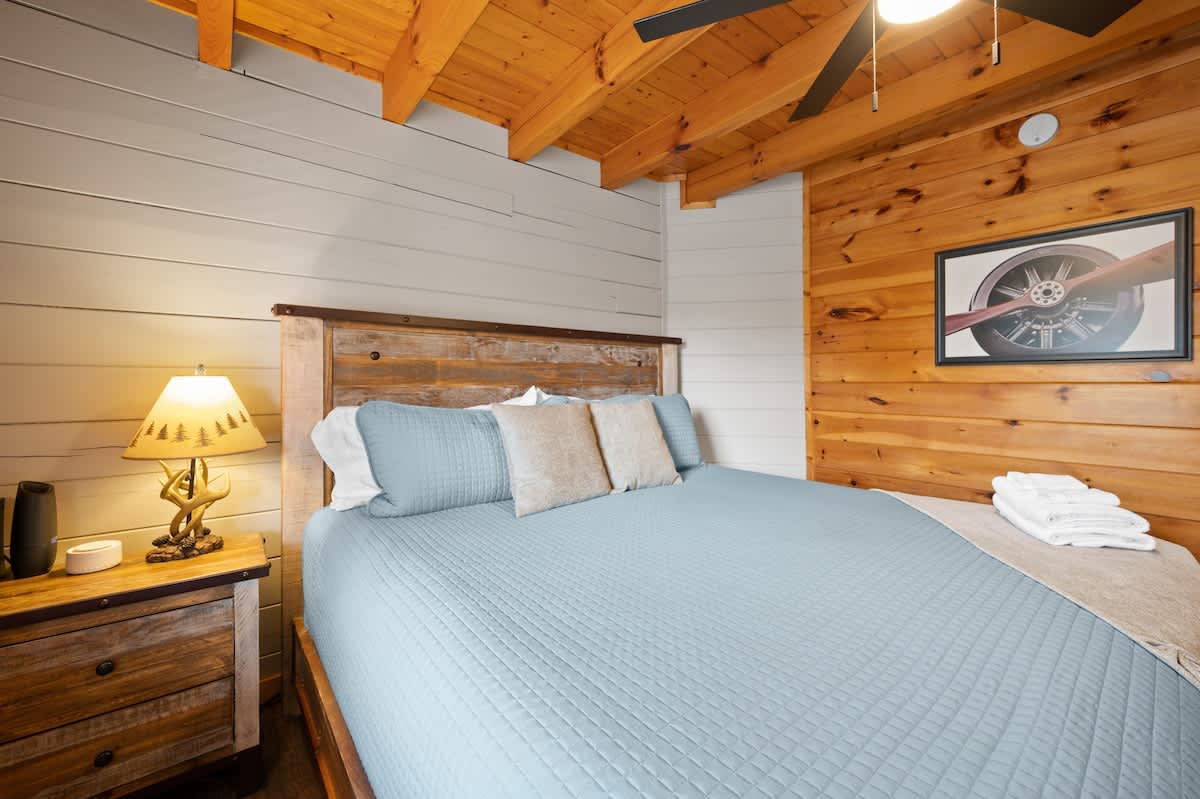 Main level bedroom (King) adjacent to kitchen area.