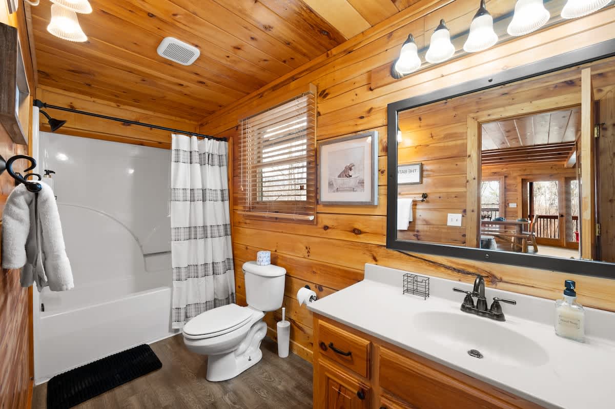 Main level bathroom adjacent to kitchen