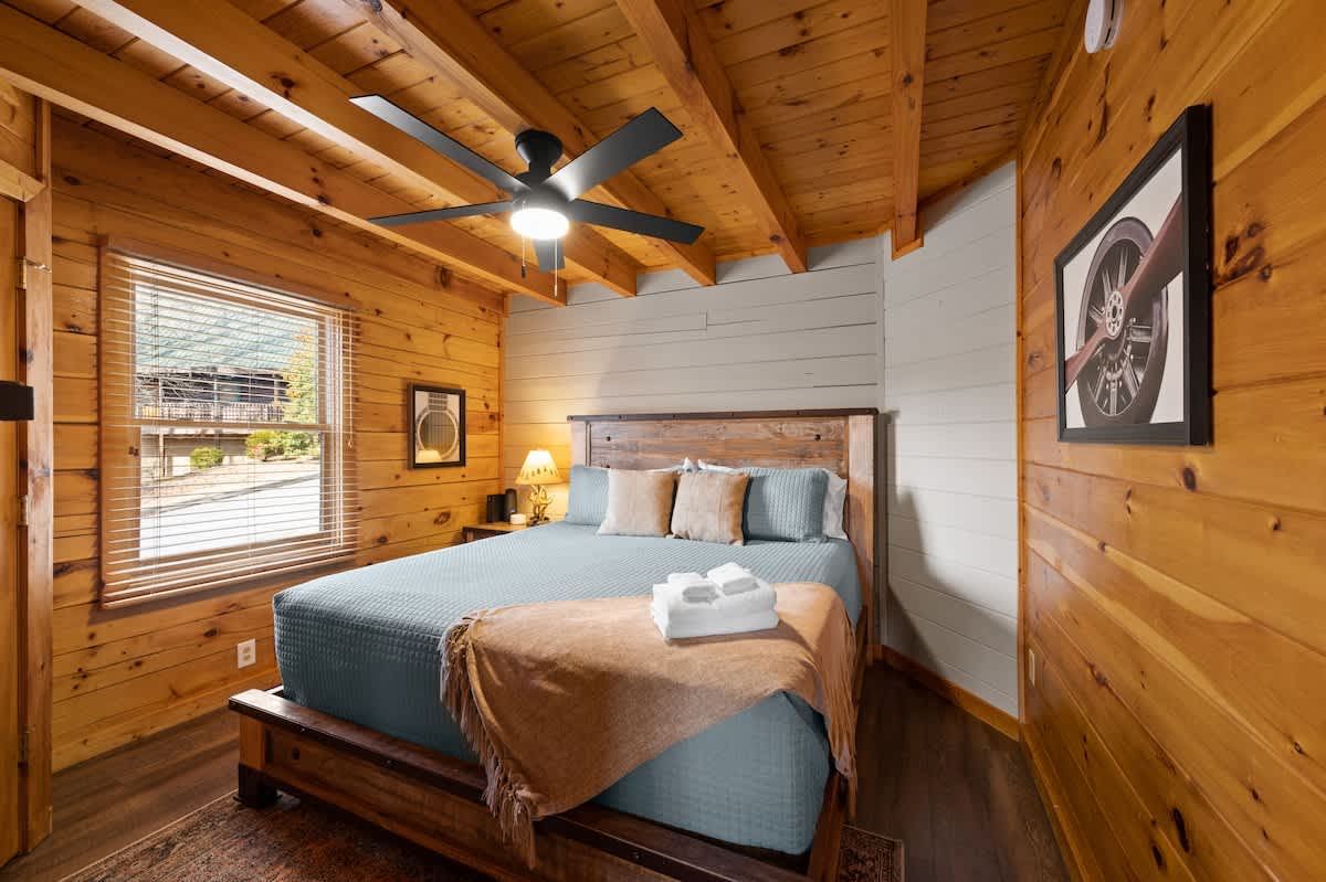 Main level bedroom (King) adjacent to kitchen area.