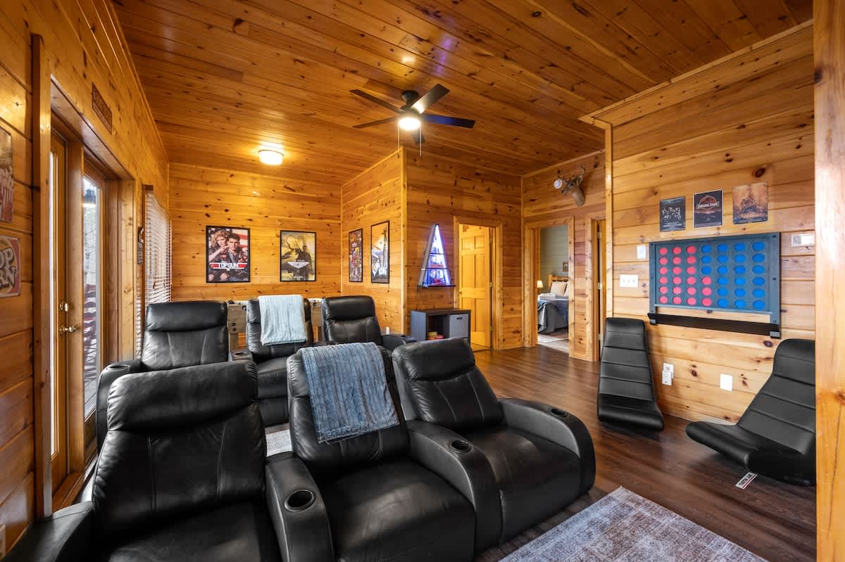 Lower level theater room seats 8!  Note the interactive games on the walls :)