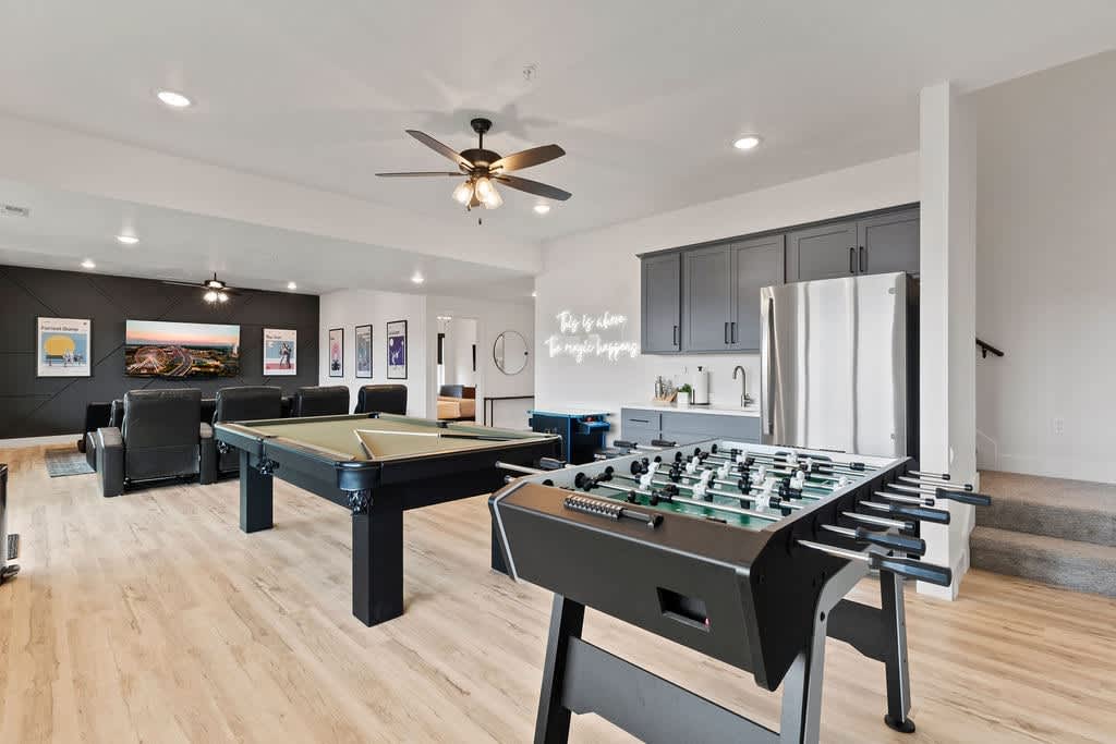 8' pool table, foosball, arcade game, kitchenette, and theater room! 