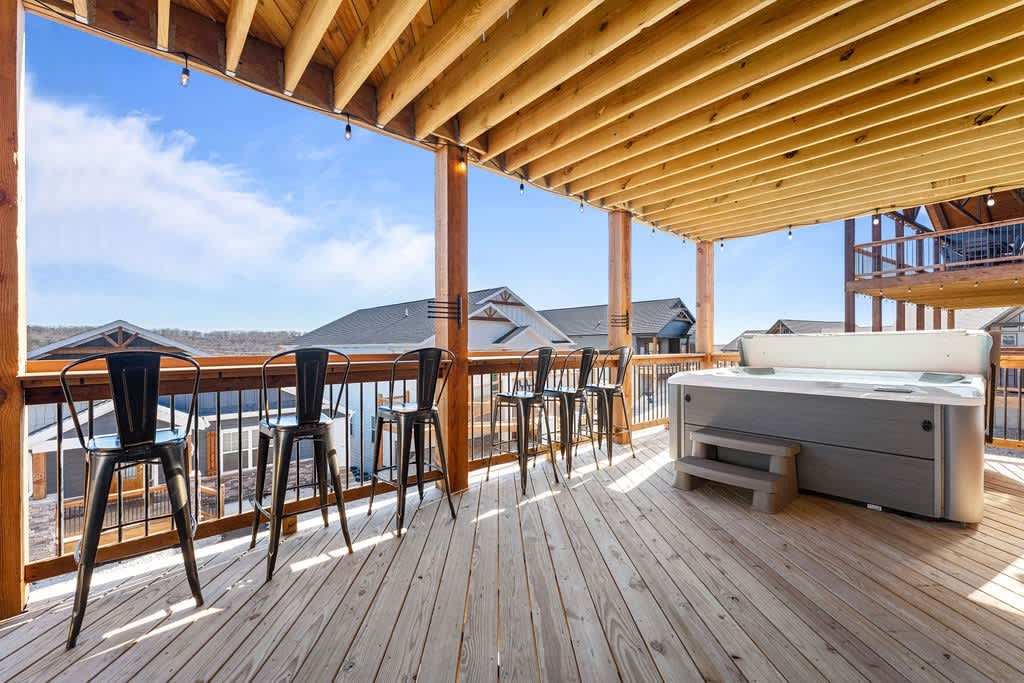 Drink Rail & 7-Person Hot Tub.  String lights all around on both decks!