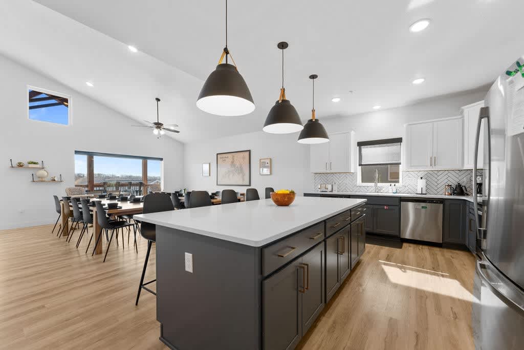 Large kitchen with dual (2) dishwashers and Dining Area that seats twenty-five (25), with two (2) high-chairs for kids.