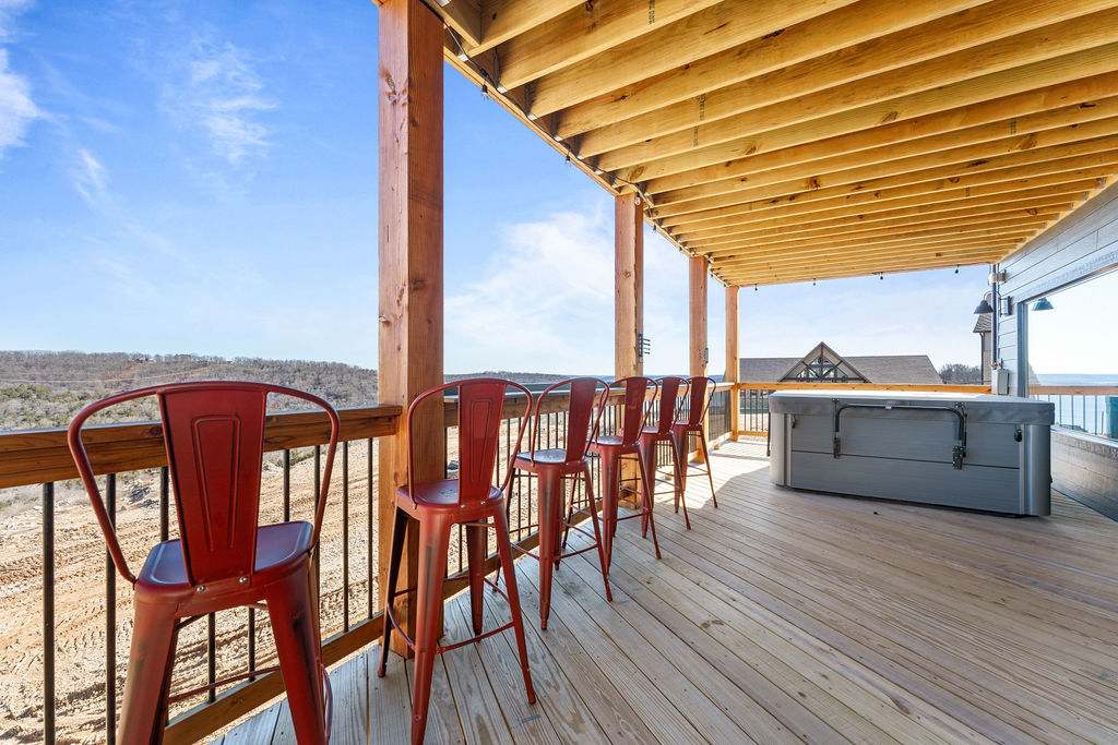 Bar stools and a drink rail to hang out with the people getting a soak in the hot tub / enjoy the view.