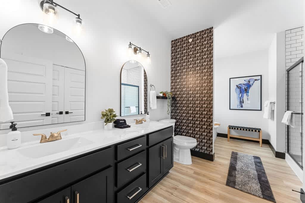 Earl decided a little black sheep accent wall would look good here, so he made it happen.  Note the beautiful double vanity!