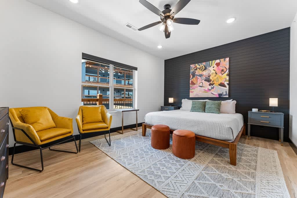 Wowza!  Very spacious primary bedroom with modern, bright colors.  King bed to boot!  Fun fact - this bed frame only has two screws :)  NOTE: Every bedroom is equipped with a white noise machine for your sleeping pleasure!
