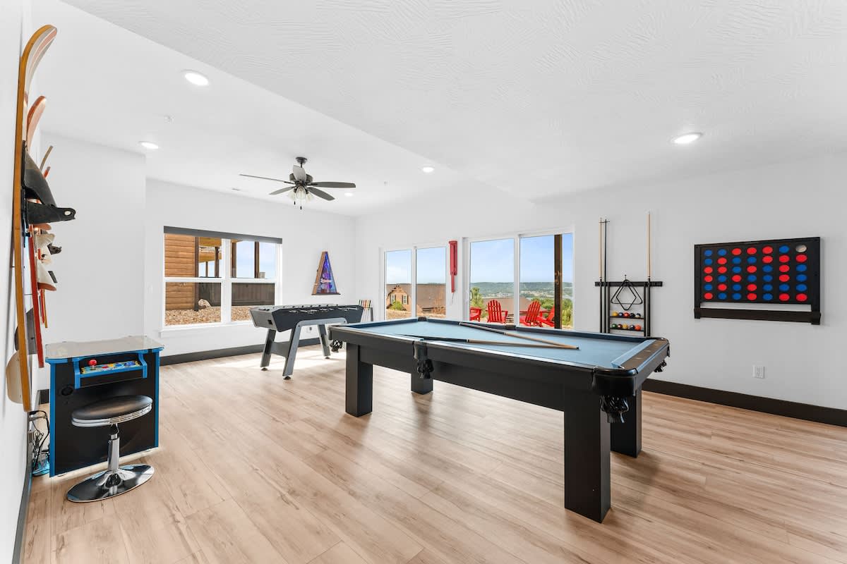 Game room with foosball, two person arcade game, wall mounted bean bag toss, full size pool table, connect 4, hook 21, AND 9' shuffleboard!  STACKED.
