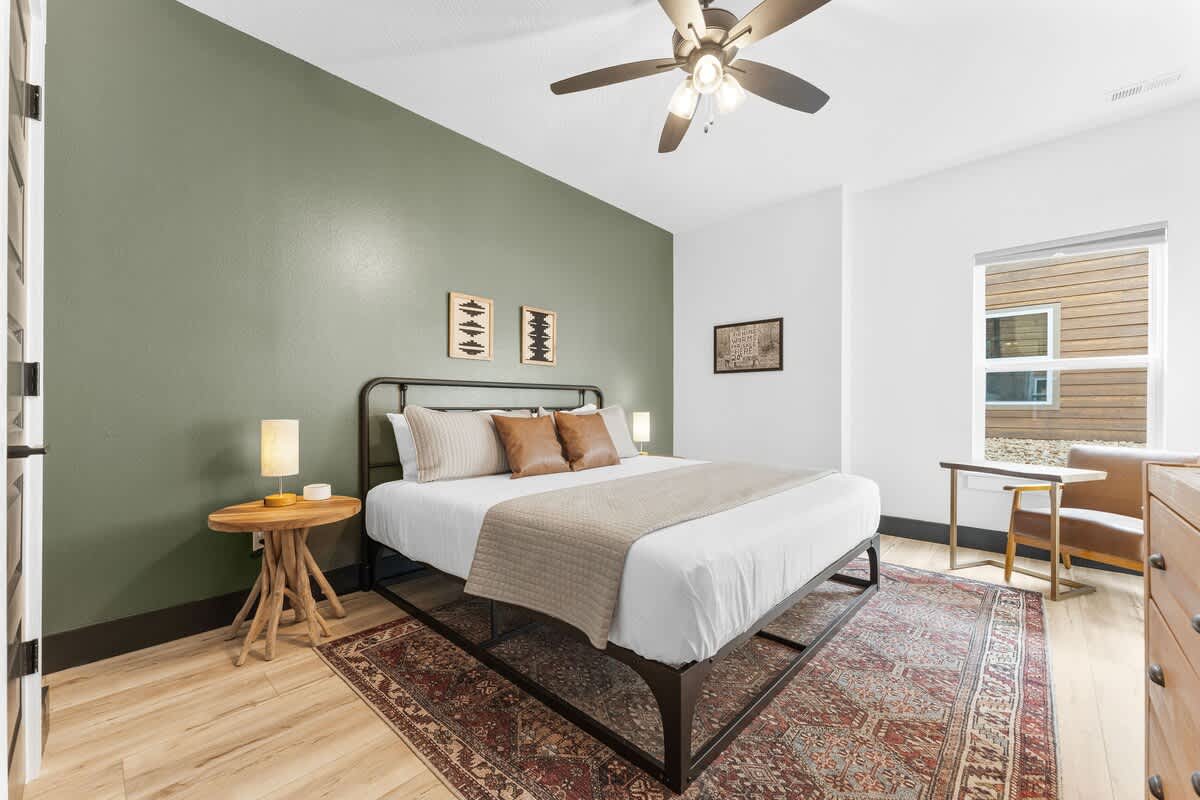 Downstairs Bedroom (King) with attached bathroom and lounge chair / computer desk