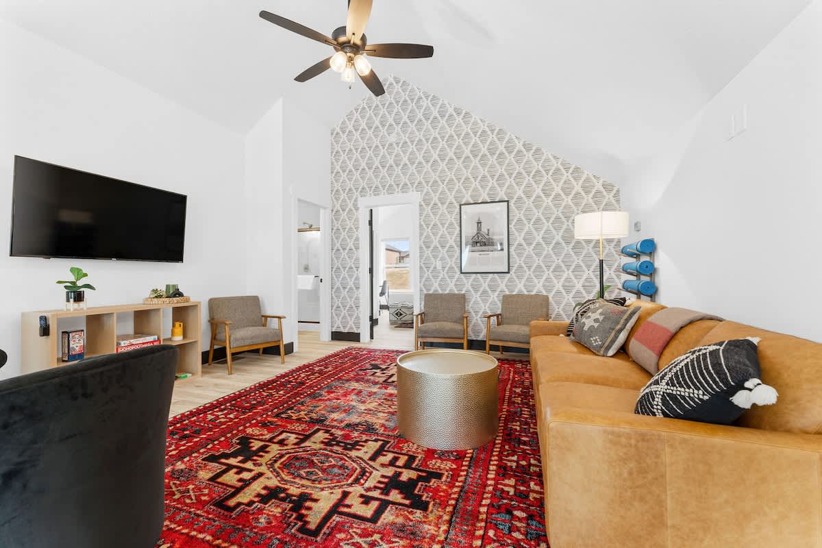 Upstairs loft living room that's great for hanging out, including YOGA MATS for your use!