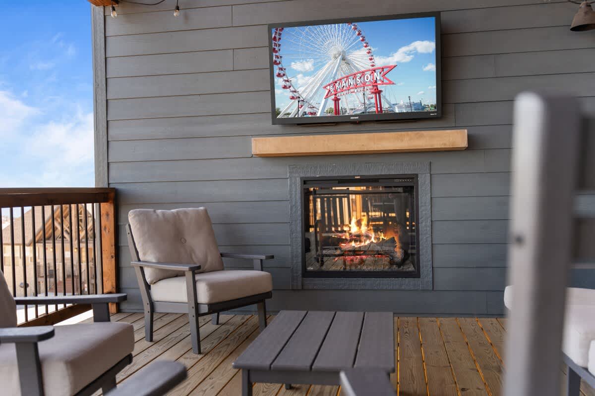 Upper Deck with Outdoor TV, Fireplace, and plenty of comfy seating