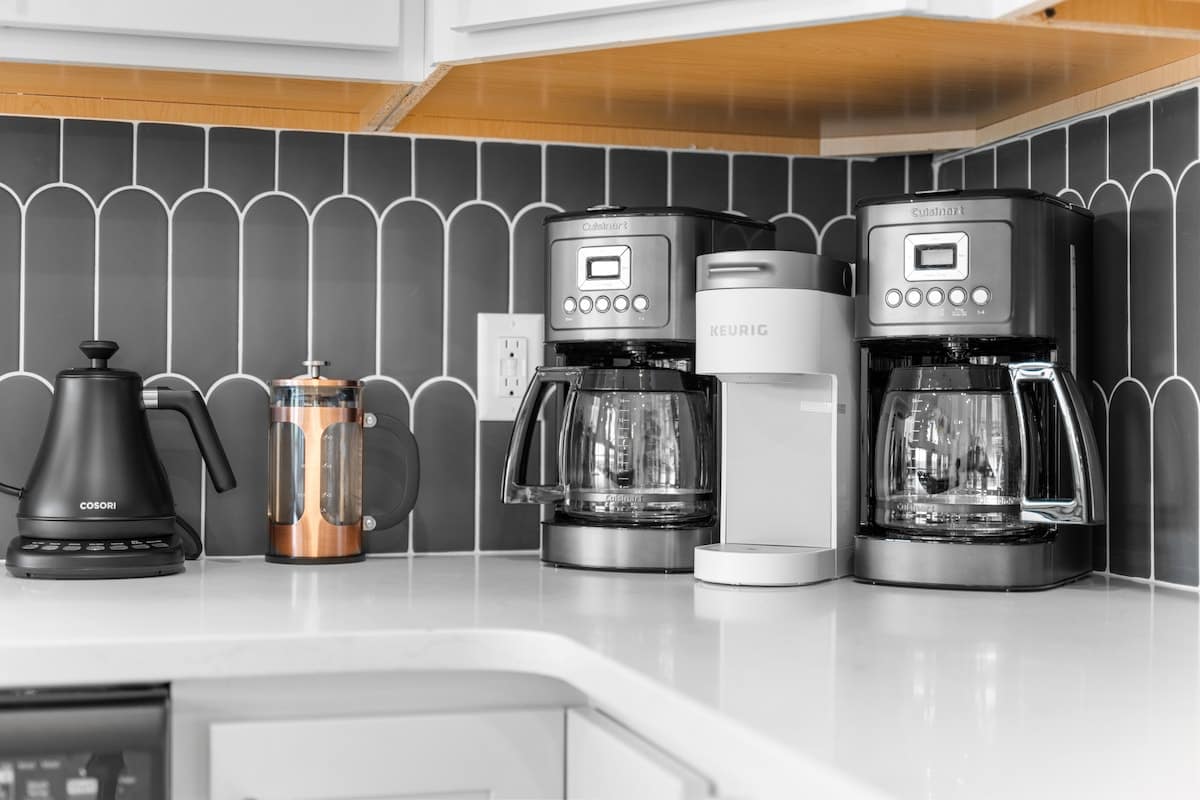You like Coffee? We have two drip coffee makers for large groups, a Keurig, French Press, and yes even a coffee grinder