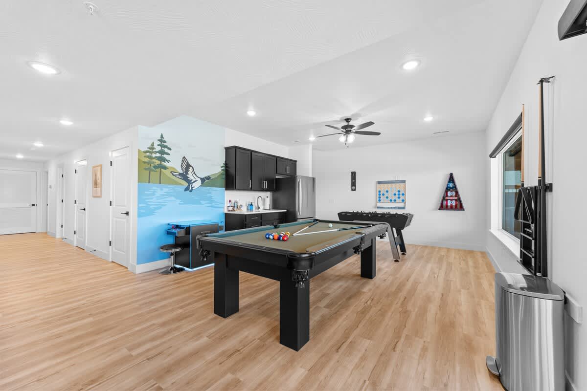 Game Room with Pool Table, Foosball, Connect Four, Boss Toss bean bag throw, and two Arcades