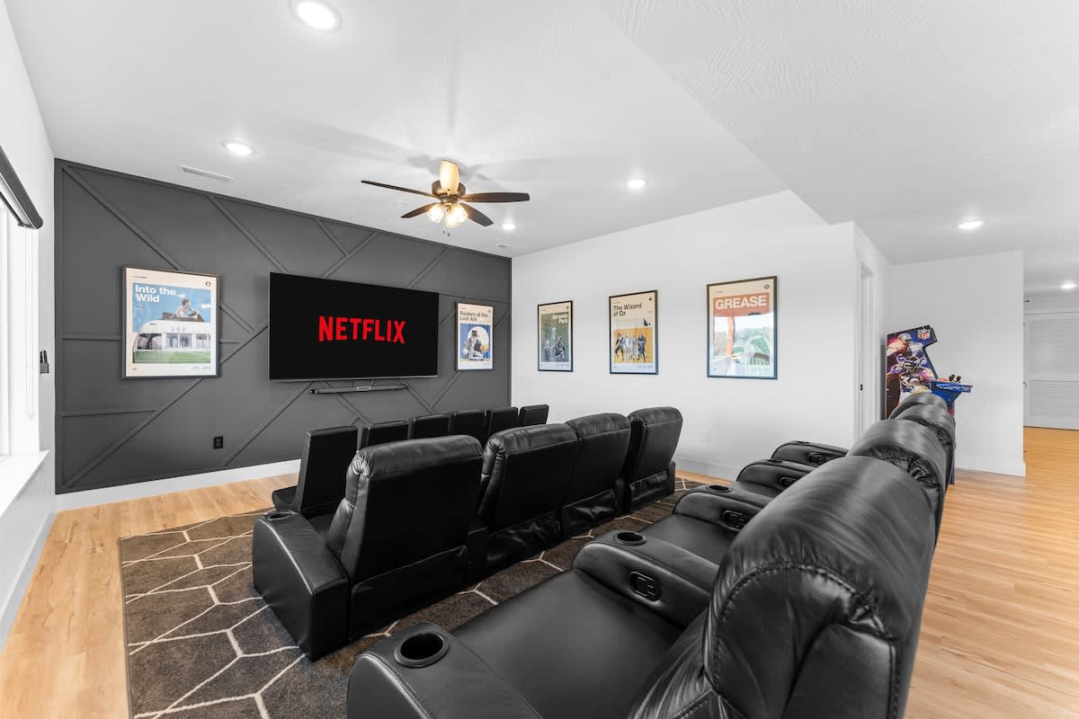 Three rows of movie theater seating with a 75" Big Screen TV and Polk Audio Sounds system for plenty of entertainment 