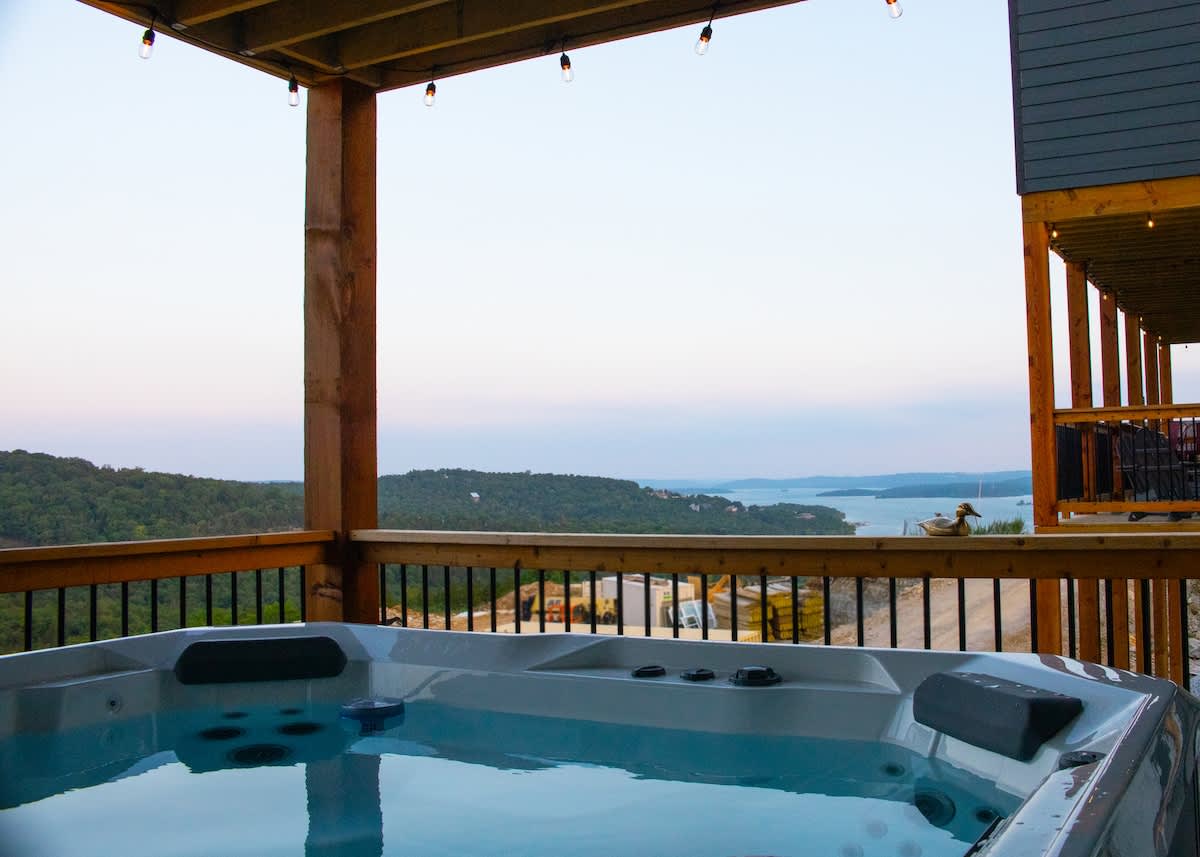 Hot Tub on the back deck with a view of  Table Rock Lake and the beautiful trees on the hills