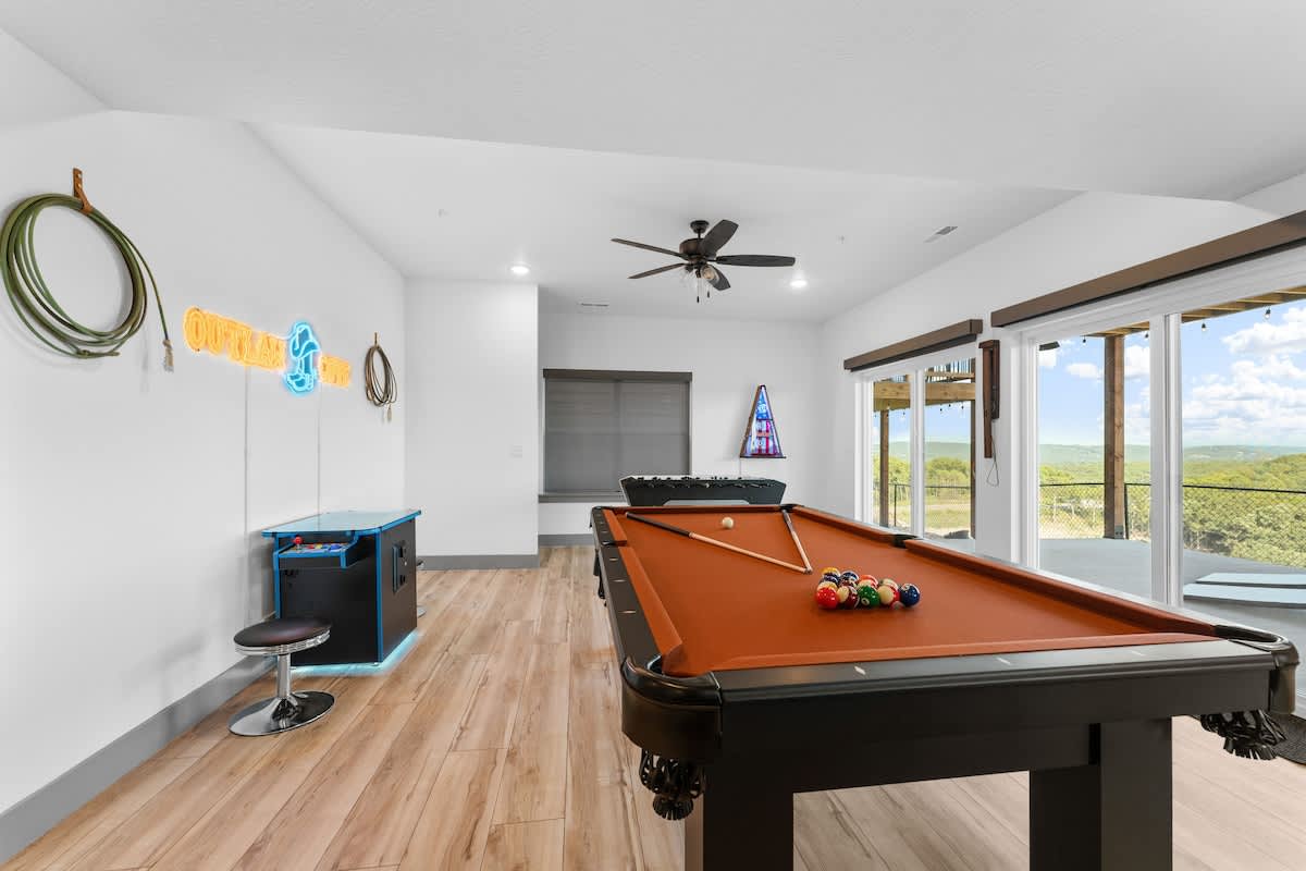 Pool Table, Foosball, Arcade Game with 2,000 games, and a Boss Toss Beanbag Game, and Hook 21 Ring Swing
