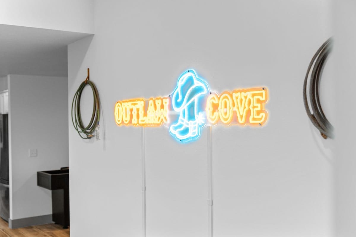 Outlaw Cove neon sign in the game room 