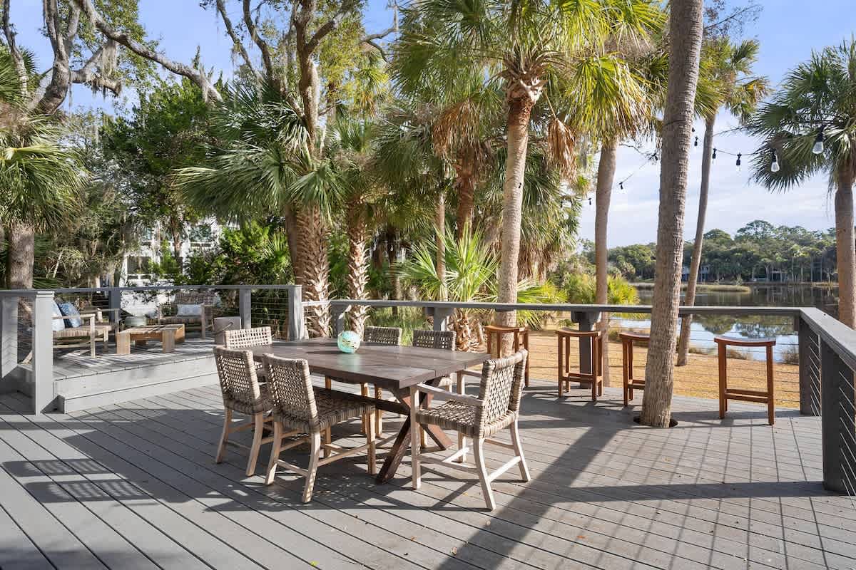 Rear Deck with Inviting Dining and Relaxing Space with Gas Grill