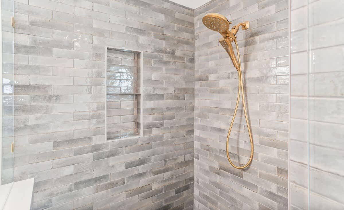 Primary Suite with En-Suite Bath Featuring a Walk-In Shower