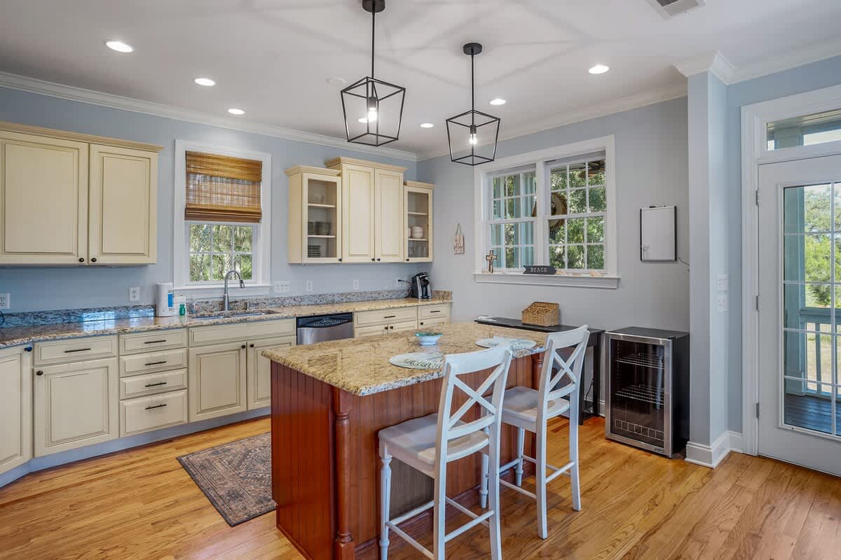 Updated Kitchen Comes with Stainless Steel Appliances—Including a Wine Cooler—and a Two-Seat Island