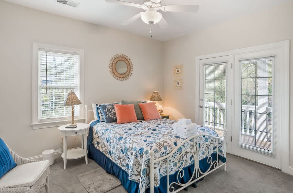 Queen Bed with Streaming TV, Private Balcony, and a Shared Jack-and-Jill Bathroom with a Shower-Tub Combo. 