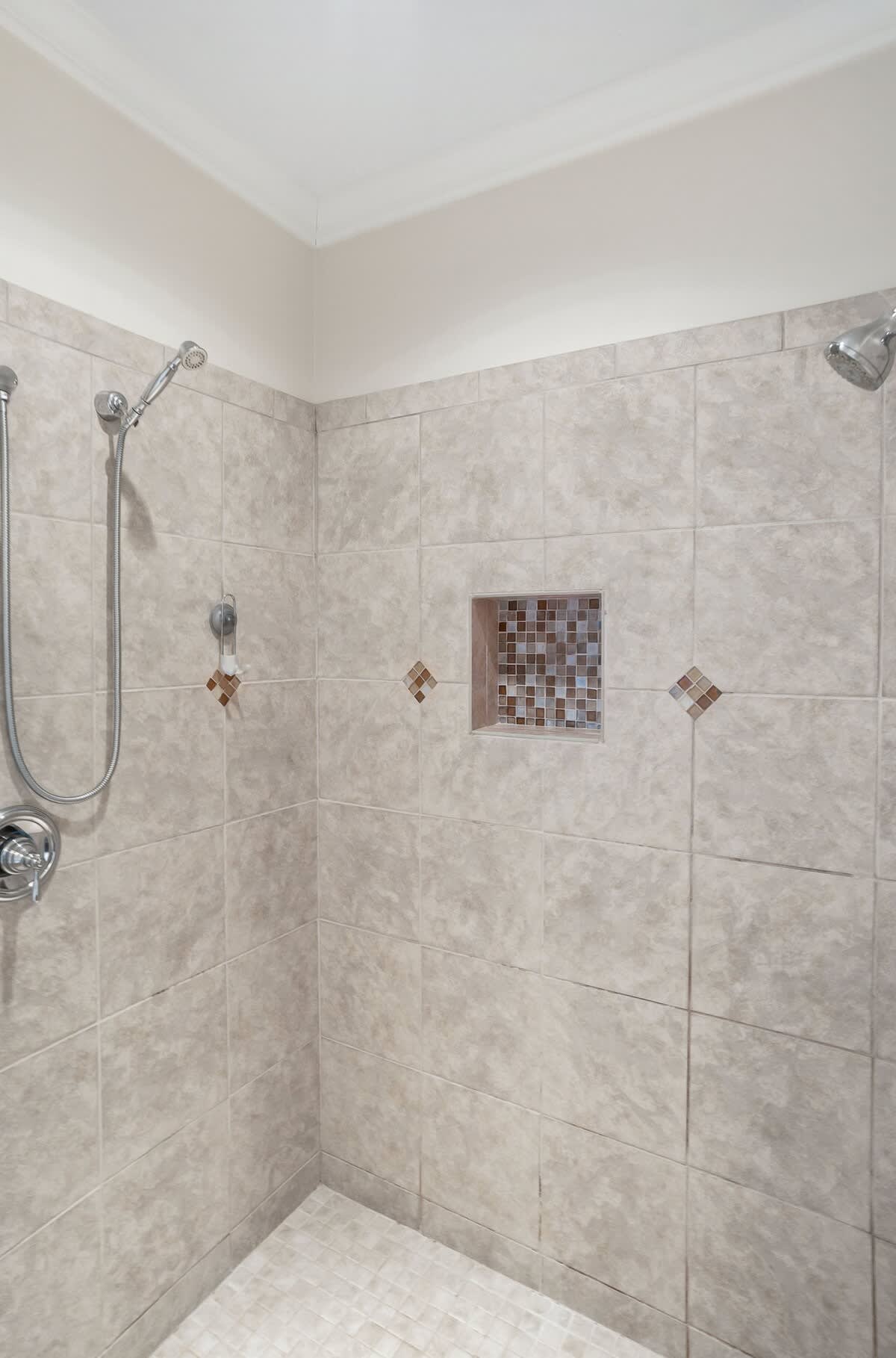 Large Primary Ensuite Bathroom with a Drop-In Tub, Walk-In Shower with Dual Shower Heads, Double Vanity, and Private Water Closet.