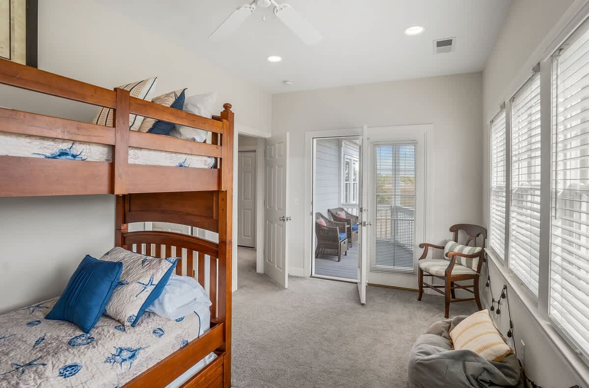 Bunk Bed (1 Trundle) with Streaming TV, Private Balcony, and a Shared Jack-and-Jill Bathroom with a Shower-Tub Combo. 
