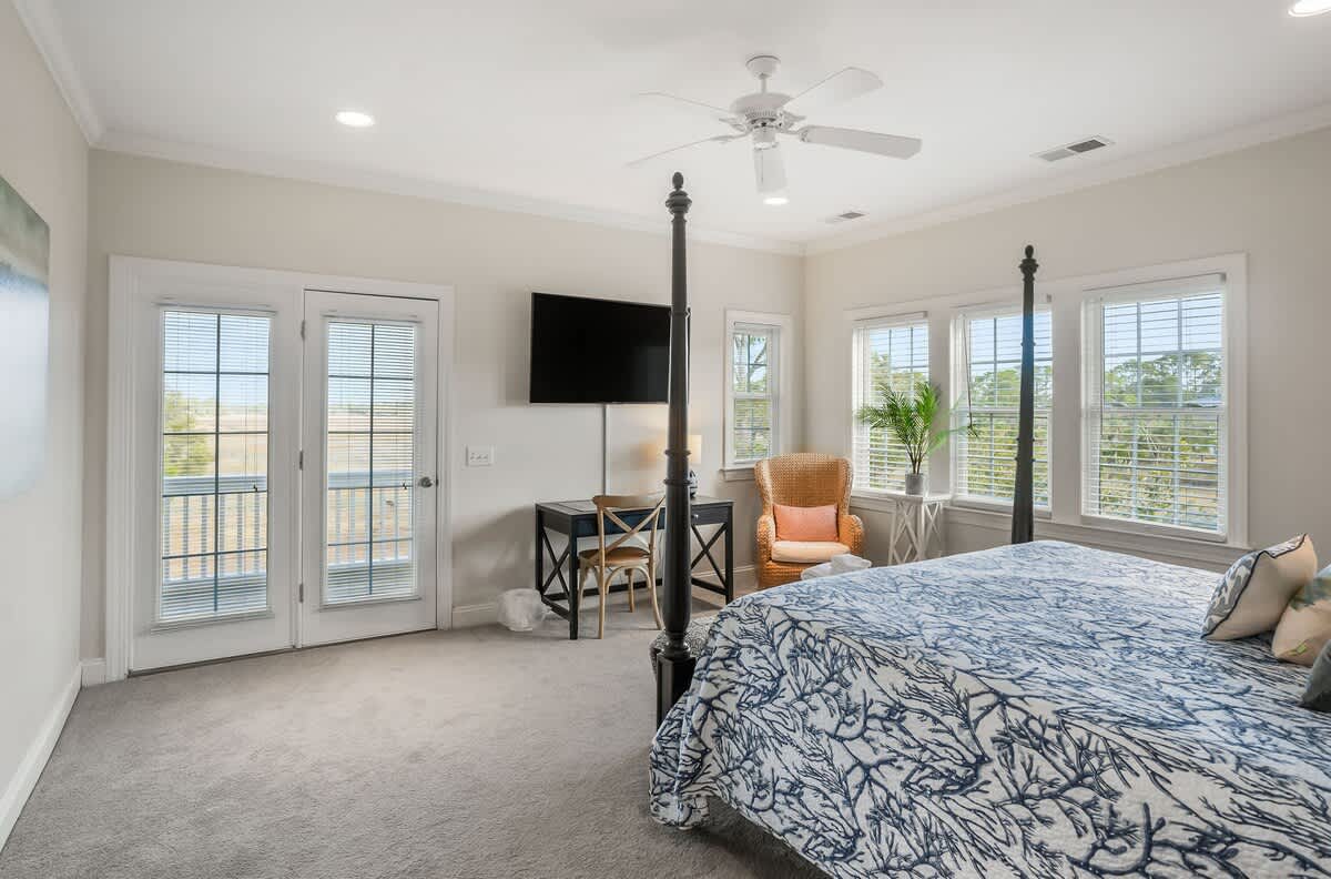 Upstairs Primary Suite has a King-Sized Bed, Streaming TV, Walk-In Closet, Private Balcony with a Large Ensuite Bathroom 