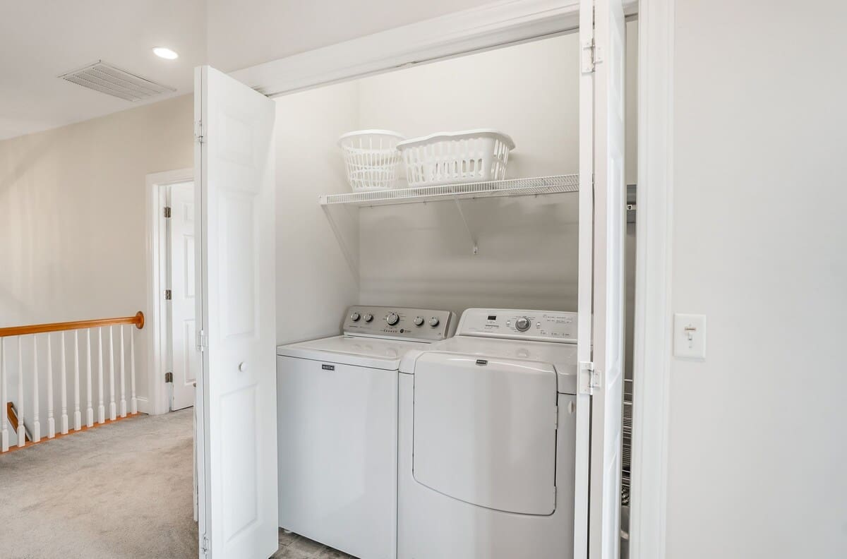 Laundry Room with a Top-Load Washer and Front-Load Dryer 