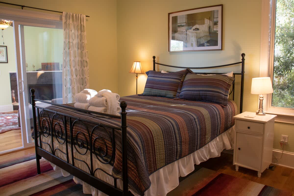 1st Level Guest Bedroom with Queen Bed and Access to Den Area