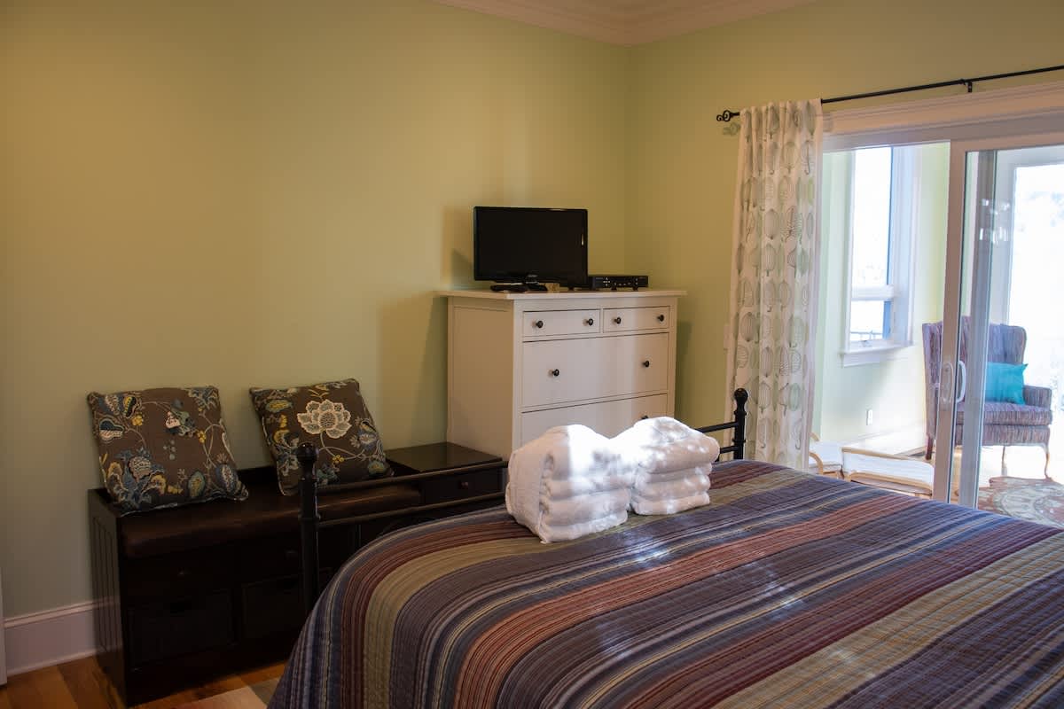 1st Level Guest Bedroom with Queen Bed and Access to Den Area