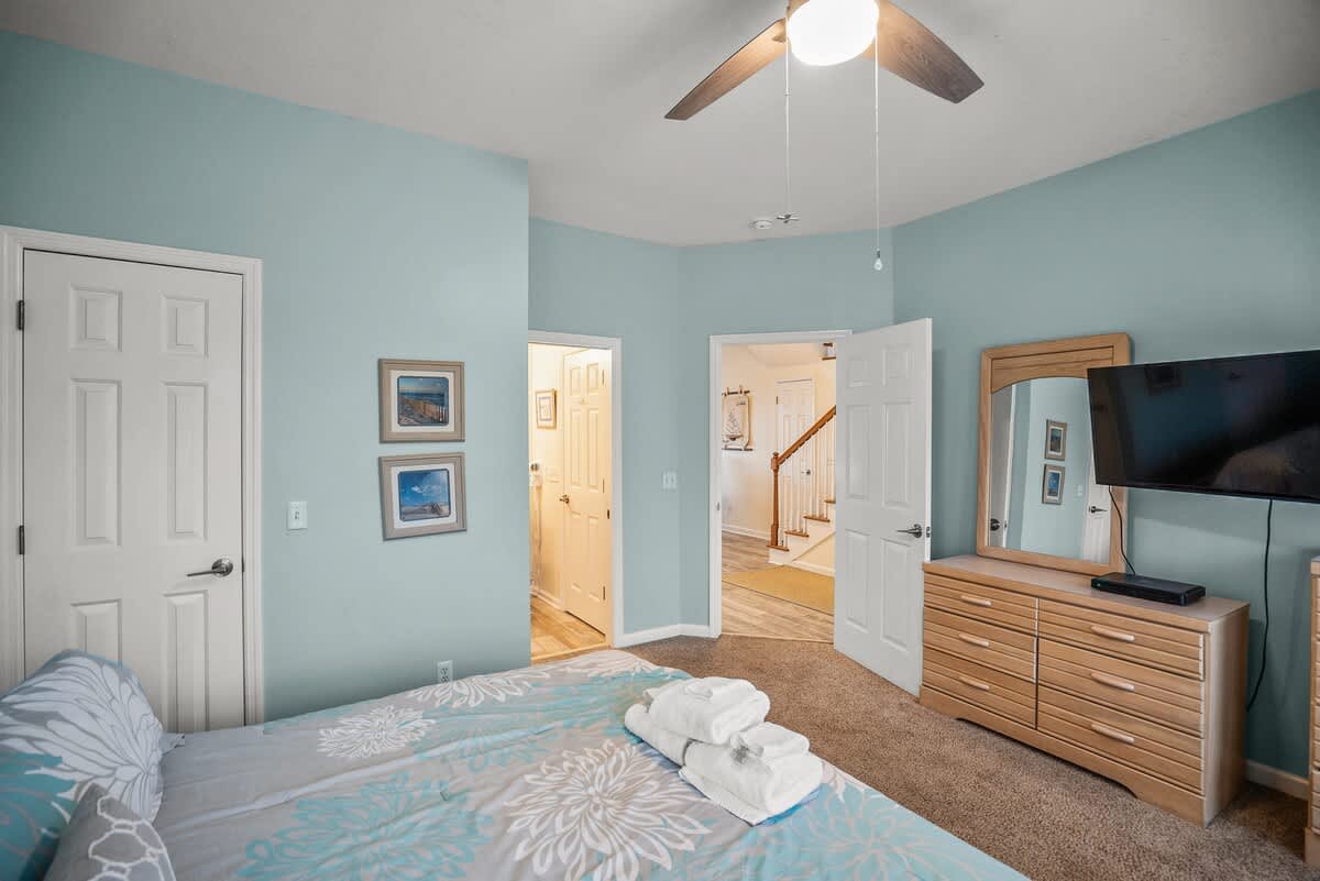 First Floor Bedroom with King Size Bed & Balcony. Access to Full Bathroom from Bedroom and Foyer. 