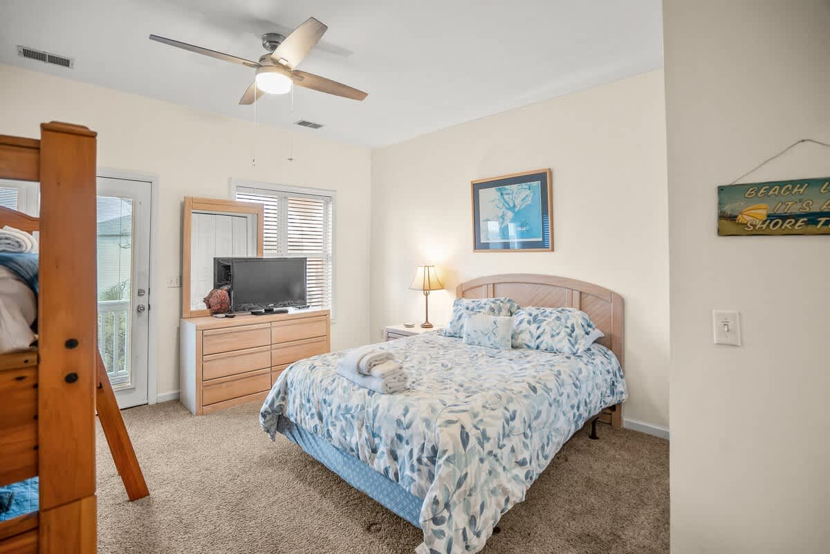 Guest Bedroom: Queen Bed with Twin Bunk Bed. Access to Deck and Full Bath Ensuite.