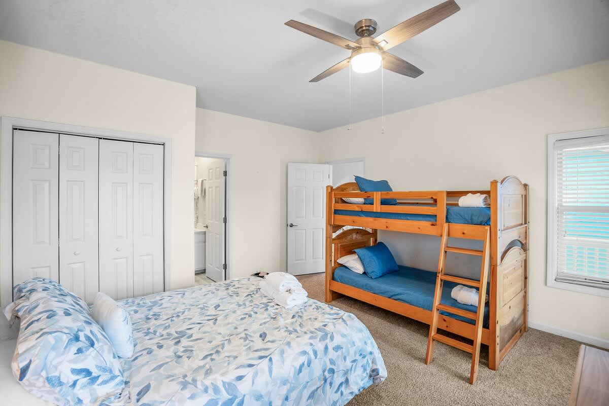Guest Bedroom: Queen Bed with Twin Bunk Bed. Access to Deck and Full Bath Ensuite.