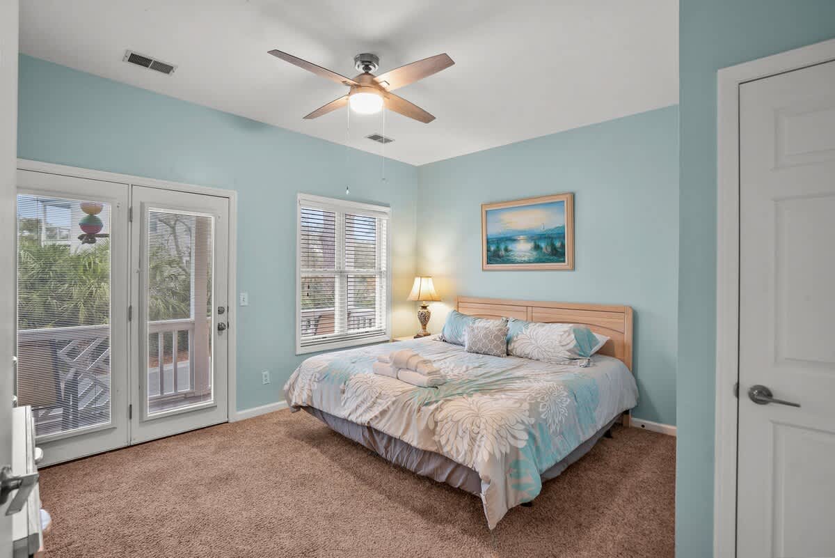 First Floor Bedroom with King Size Bed & Balcony. Access to Full Bathroom from Bedroom and Foyer. 