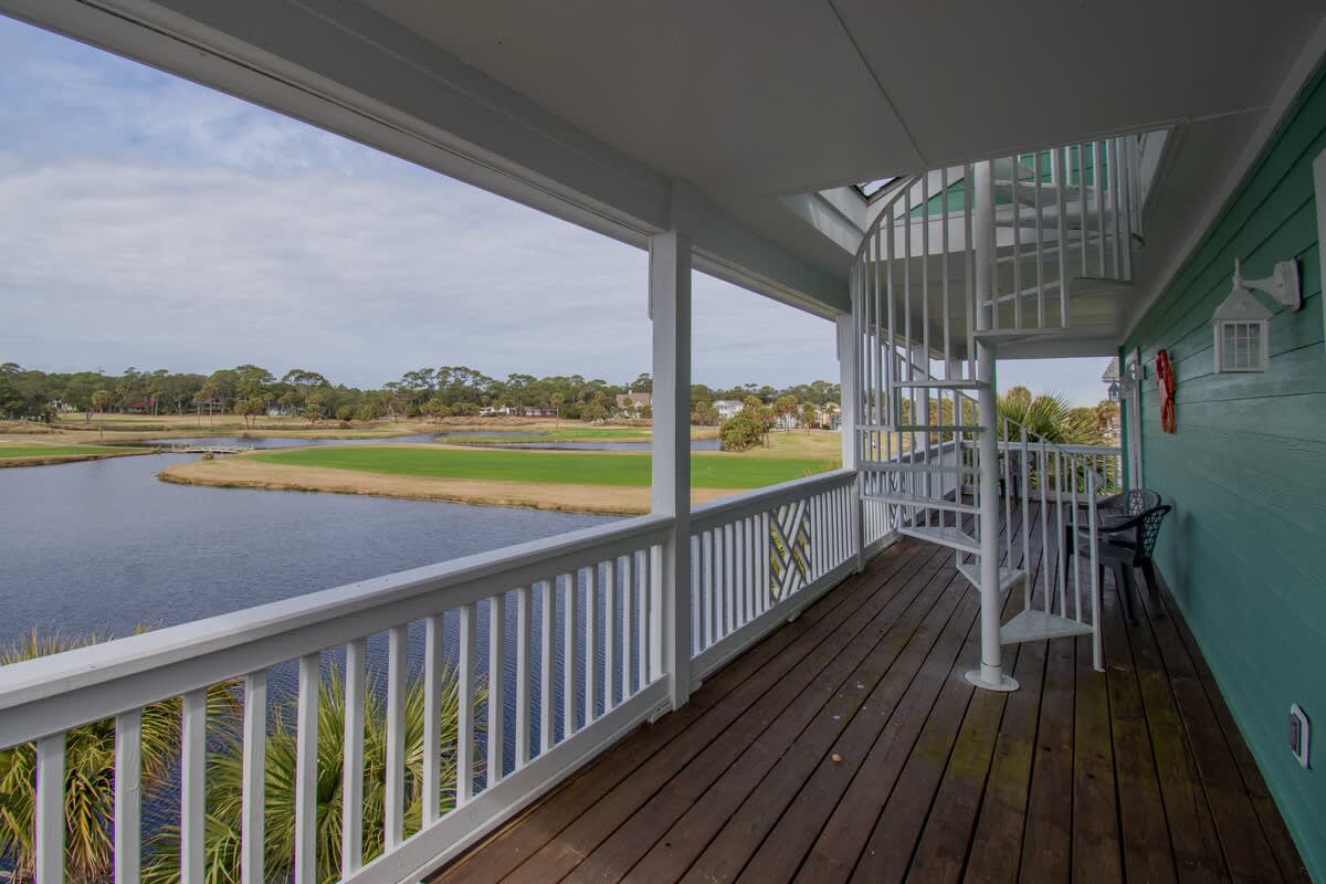 Stairs from balcony to rooftop deck